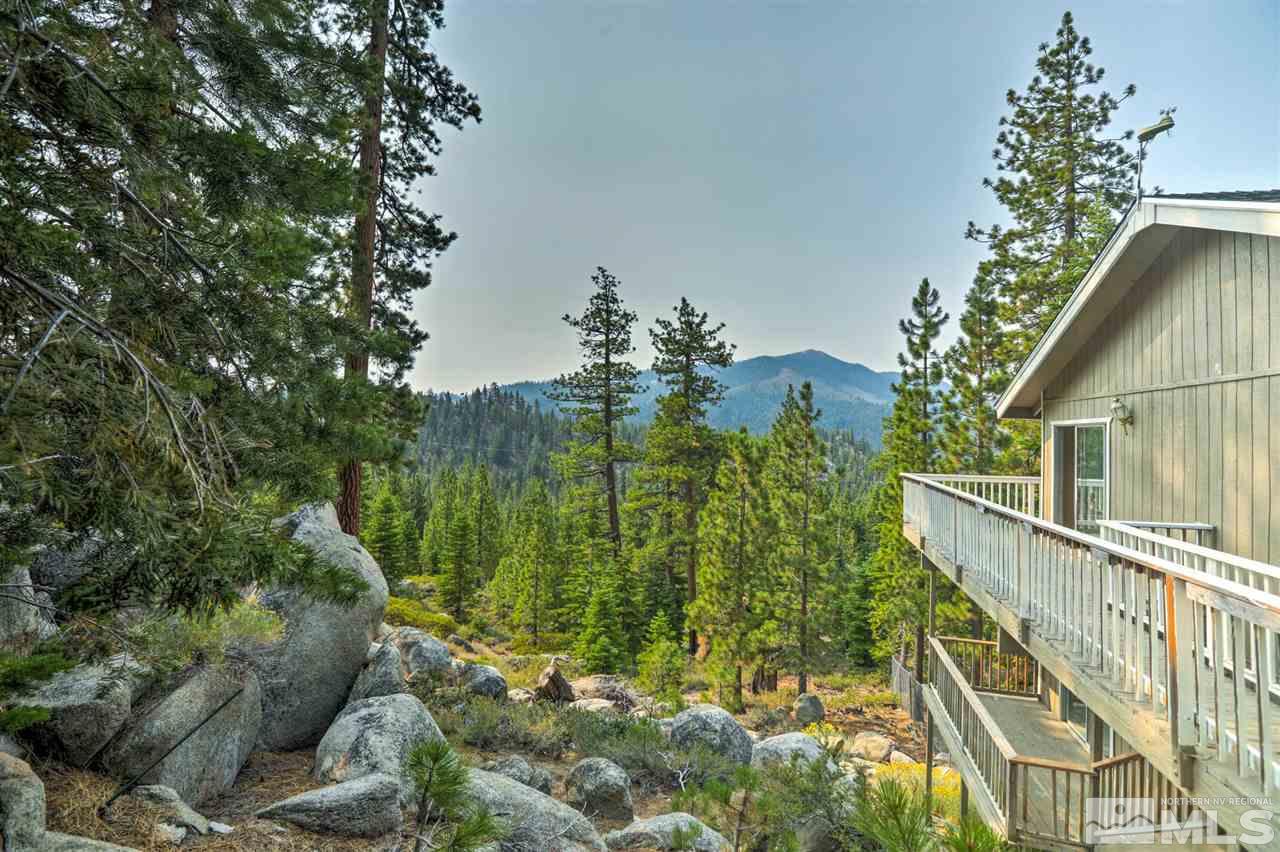 321 Barton Drive Stateline, NV 89449 - Photo 16 of 23 a view of a yard with plants and wooden fence