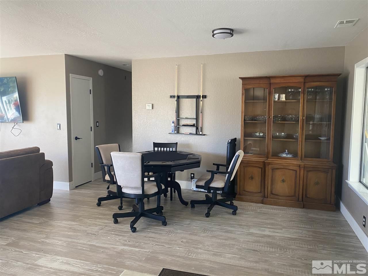 321 Barton Drive Stateline, NV 89449 - Photo 6 of 23 a workspace room with wooden floor and furniture