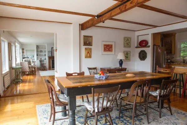 a view of a dining room with furniture and chandelier