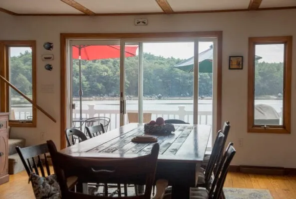 a dining room with furniture window and outside view