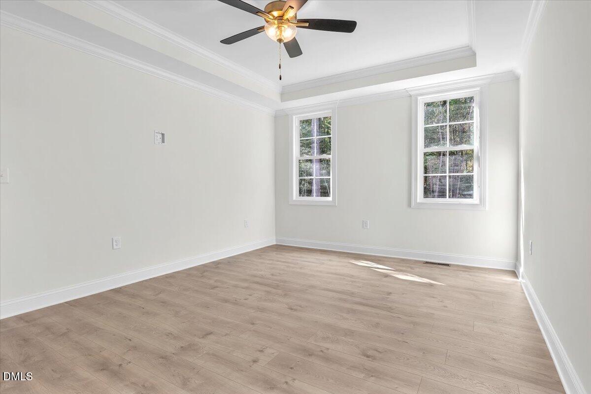 12845 Mallard Rock Road Zebulon, NC 27597 - Photo 36 of 63 an empty room with windows and fan