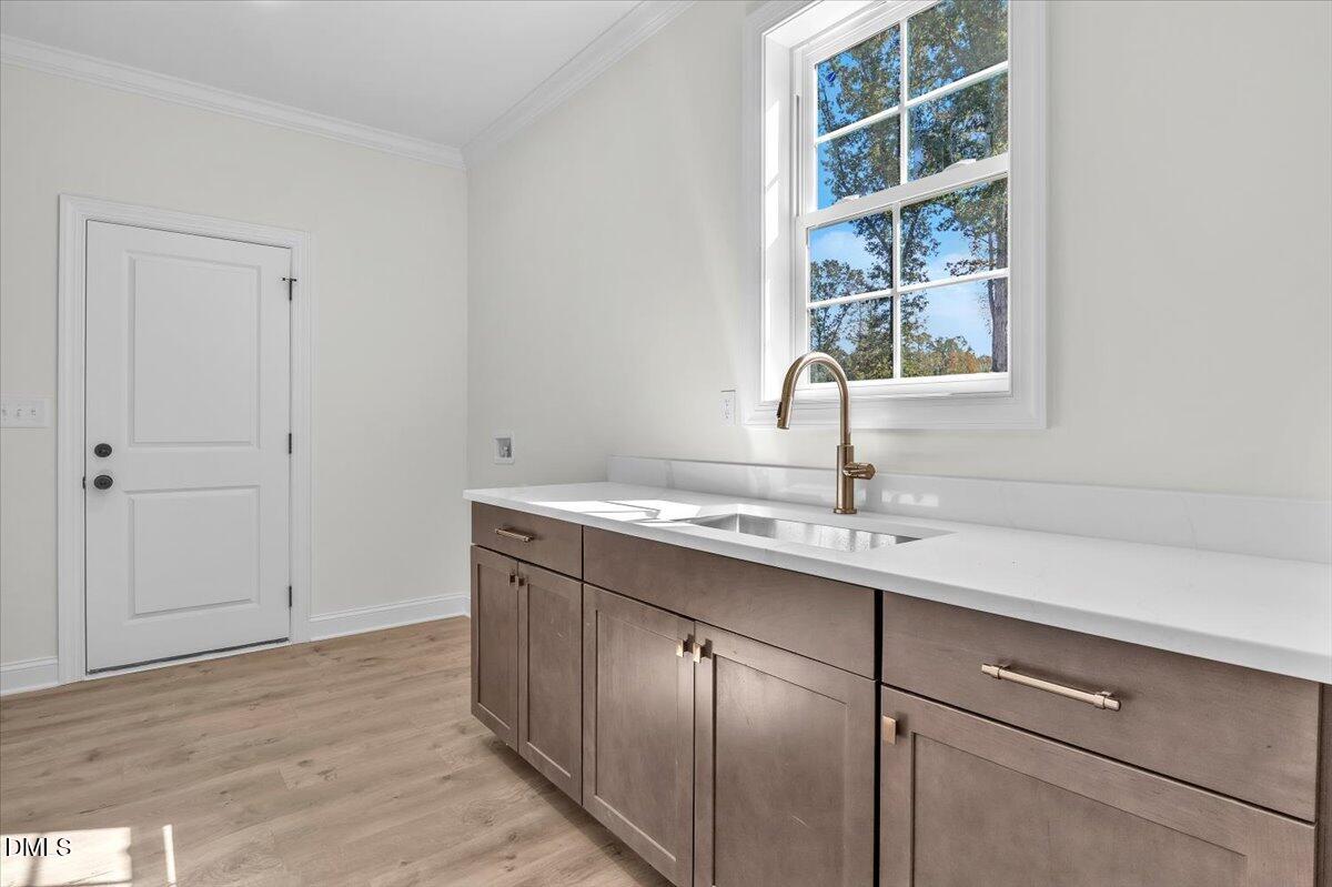 12845 Mallard Rock Road Zebulon, NC 27597 - Photo 50 of 63 a bathroom with a sink and a window
