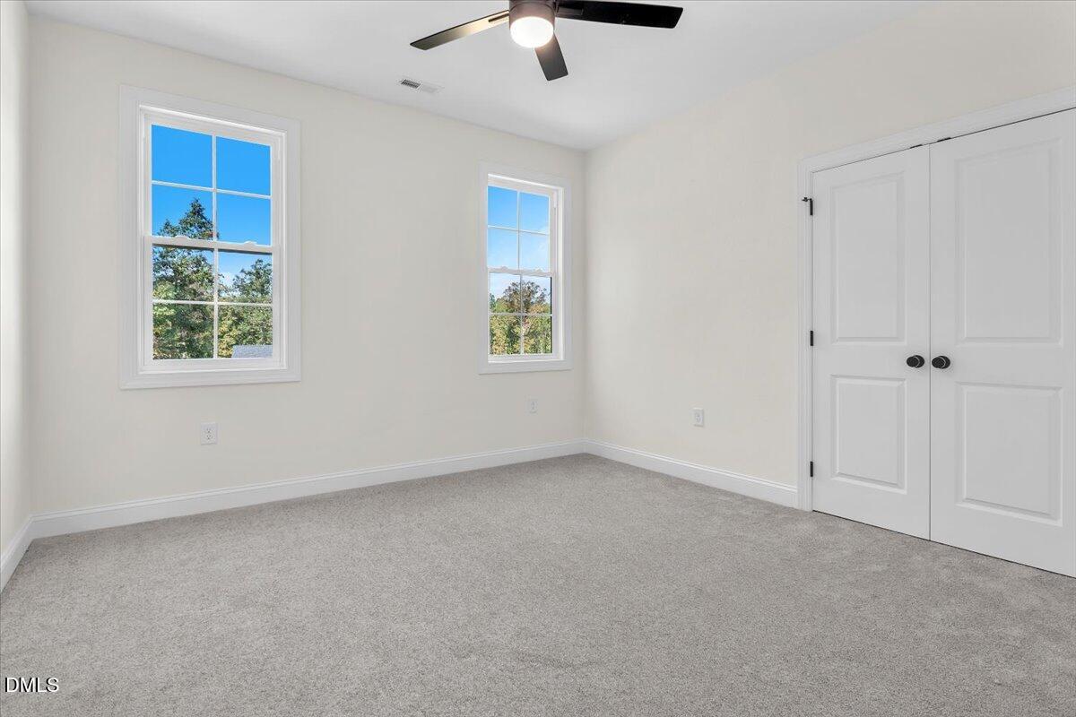 12845 Mallard Rock Road Zebulon, NC 27597 - Photo 56 of 63 a view of an empty room with a window
