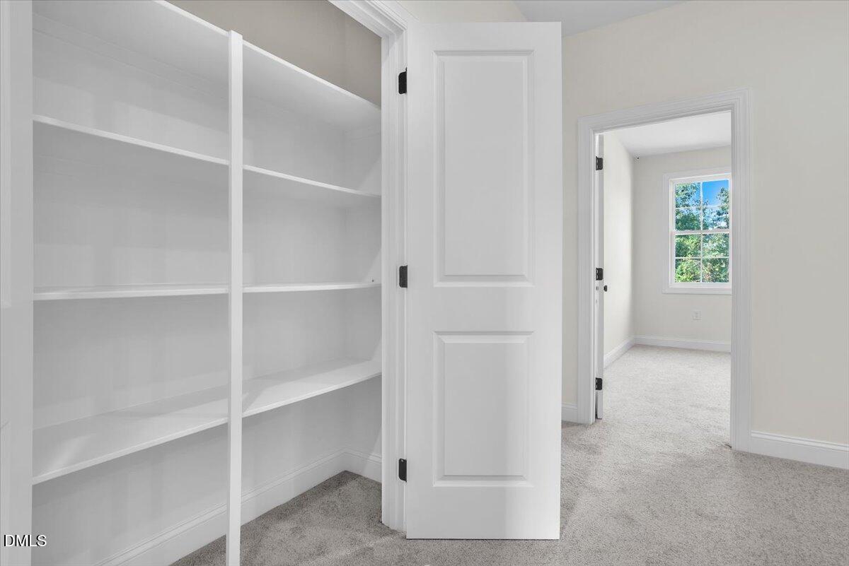 12845 Mallard Rock Road Zebulon, NC 27597 - Photo 57 of 63 a view of an empty walk in closet