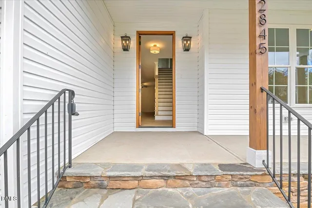 a view of room with window and wooden floor