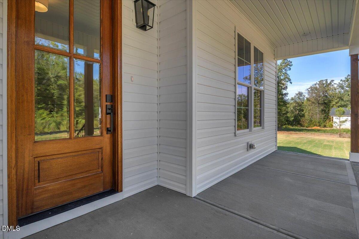 12845 Mallard Rock Road Zebulon, NC 27597 - Photo 9 of 63 a view of front door and bedroom