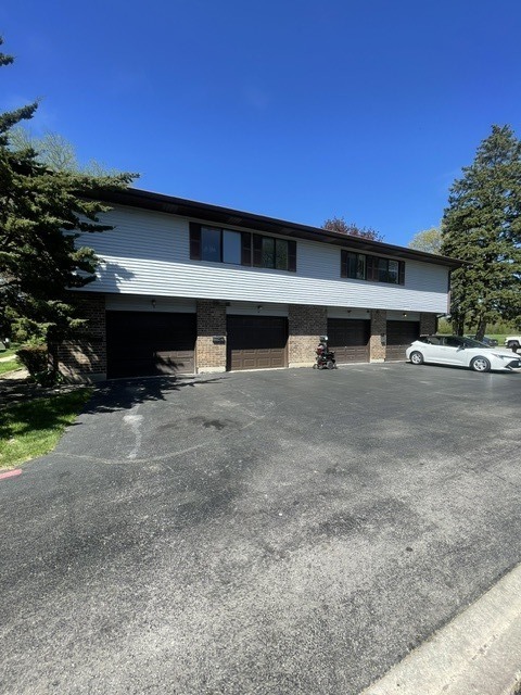 1590 Perry Court, Unit A Aurora, IL 60505 - Photo 3 of 17 a view of house with outdoor space