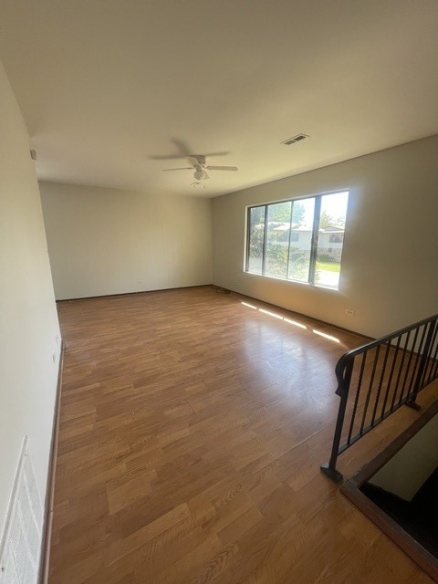 1590 Perry Court, Unit A Aurora, IL 60505 - Photo 4 of 17 an empty room with windows
