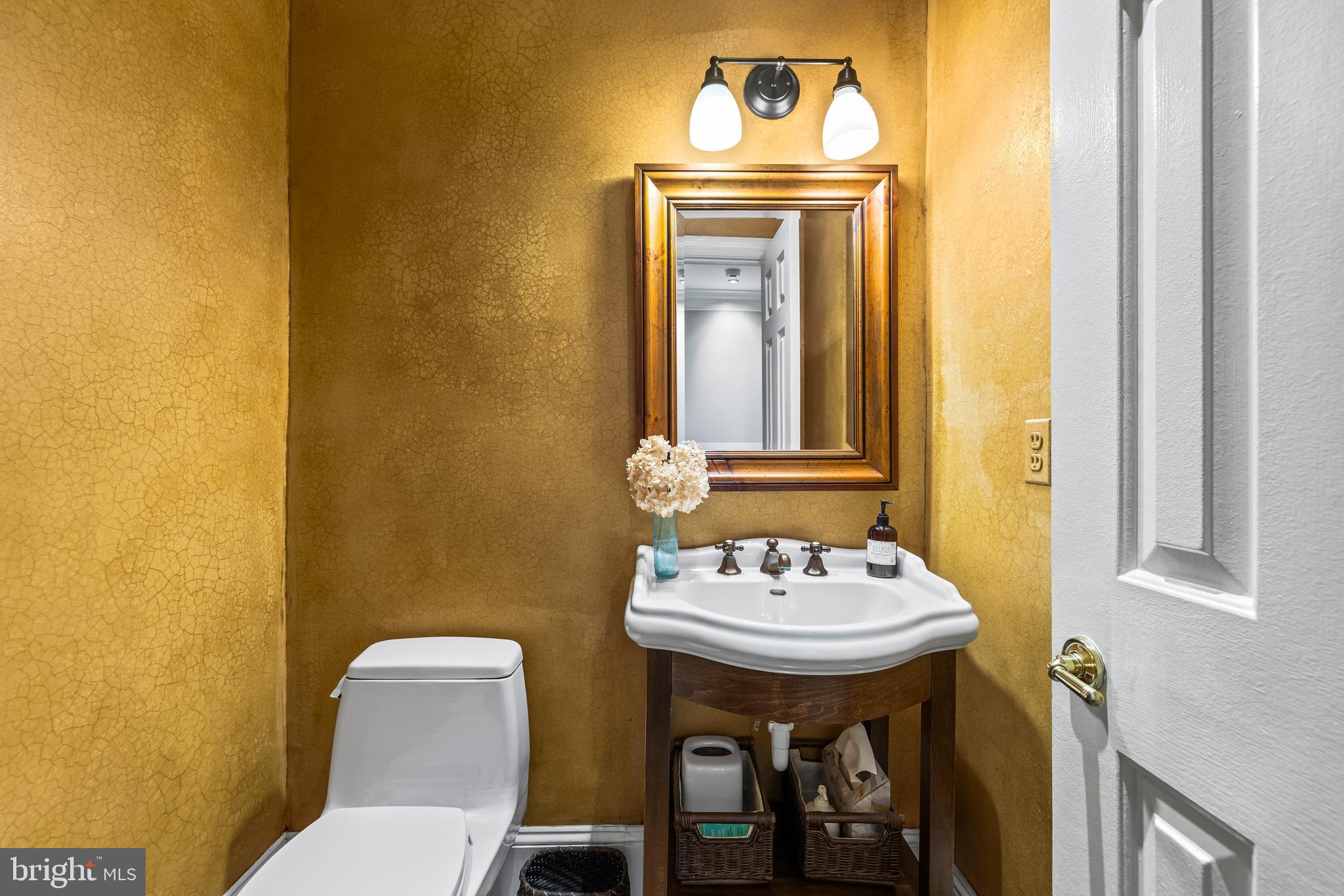 901 Chestnut Ridge Drive Lutherville-Timonium, MD 21093 - Photo 12 of 138 a bathroom with a sink and a mirror