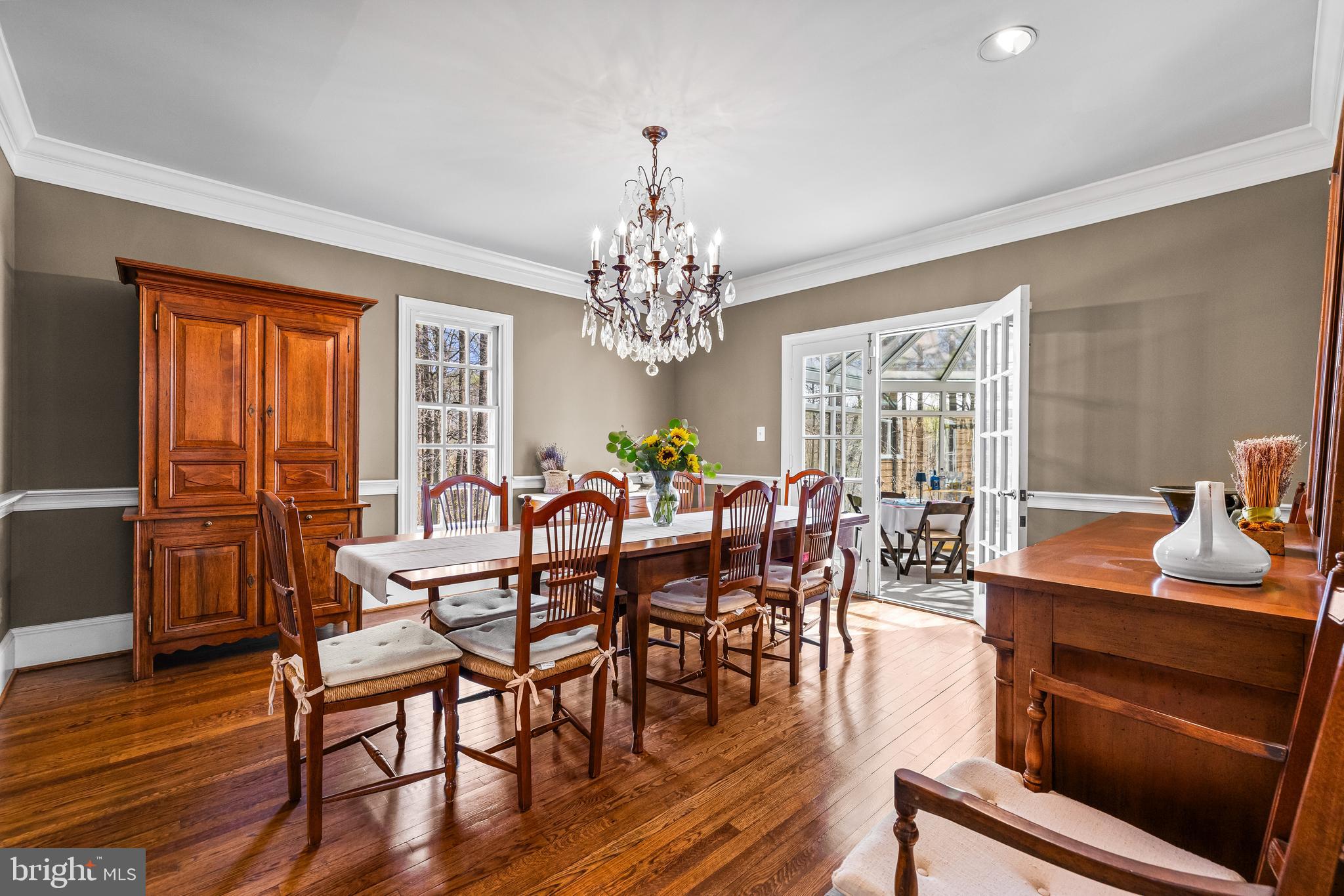 901 Chestnut Ridge Drive Lutherville-Timonium, MD 21093 - Photo 19 of 138 a view of a dining room with furniture window and wooden floor