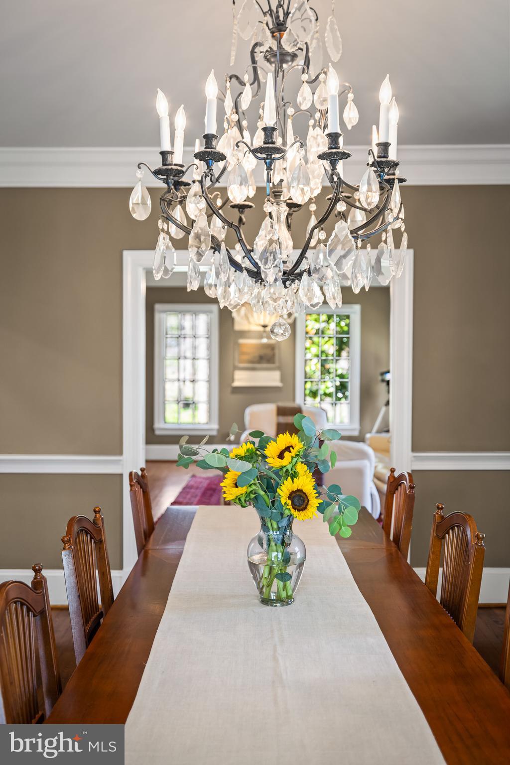 901 Chestnut Ridge Drive Lutherville-Timonium, MD 21093 - Photo 20 of 138 a living room with patio furniture and a chandelier