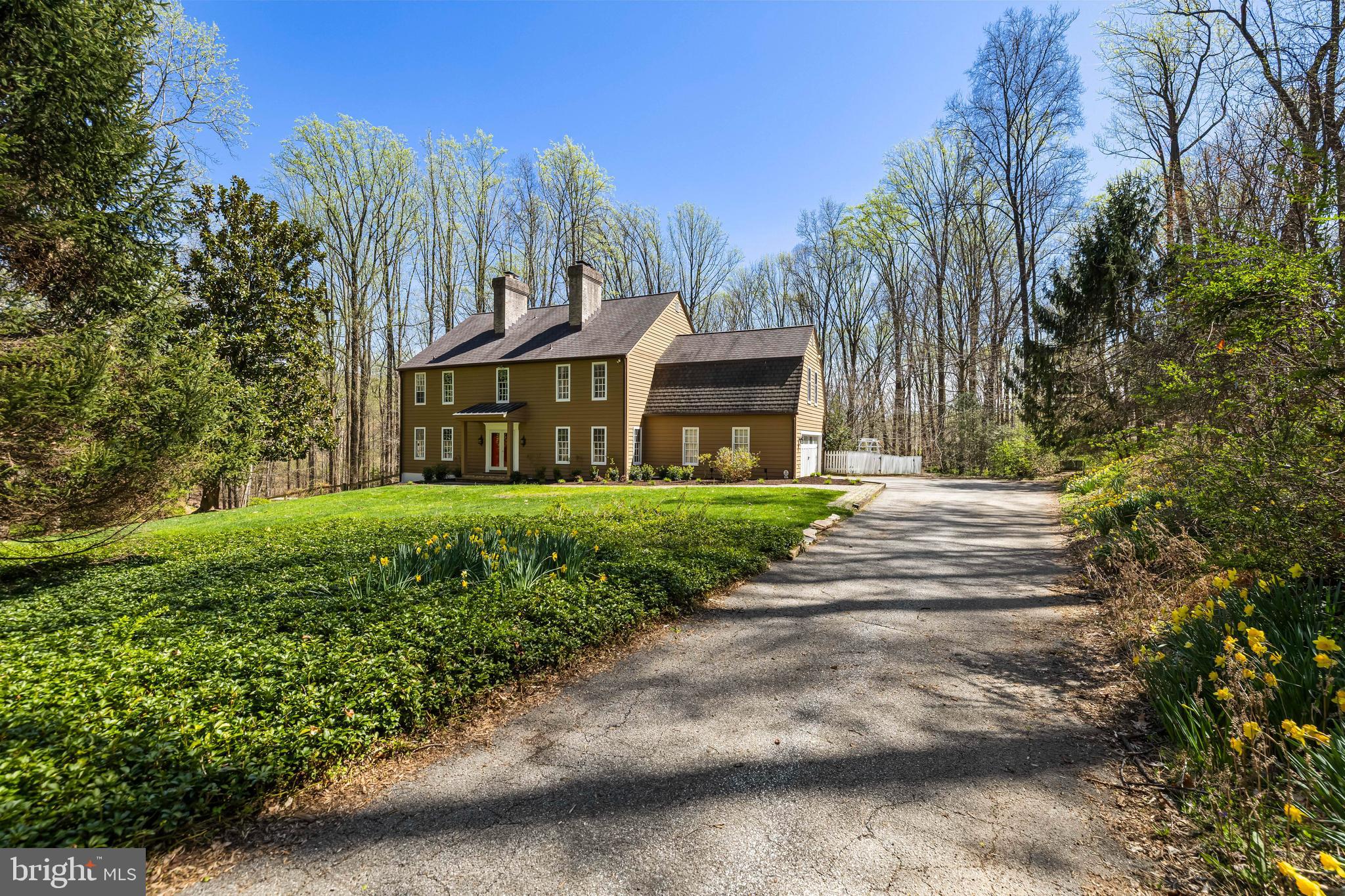 901 Chestnut Ridge Drive Lutherville-Timonium, MD 21093 - Photo 2 of 138 a front view of a house with a garden