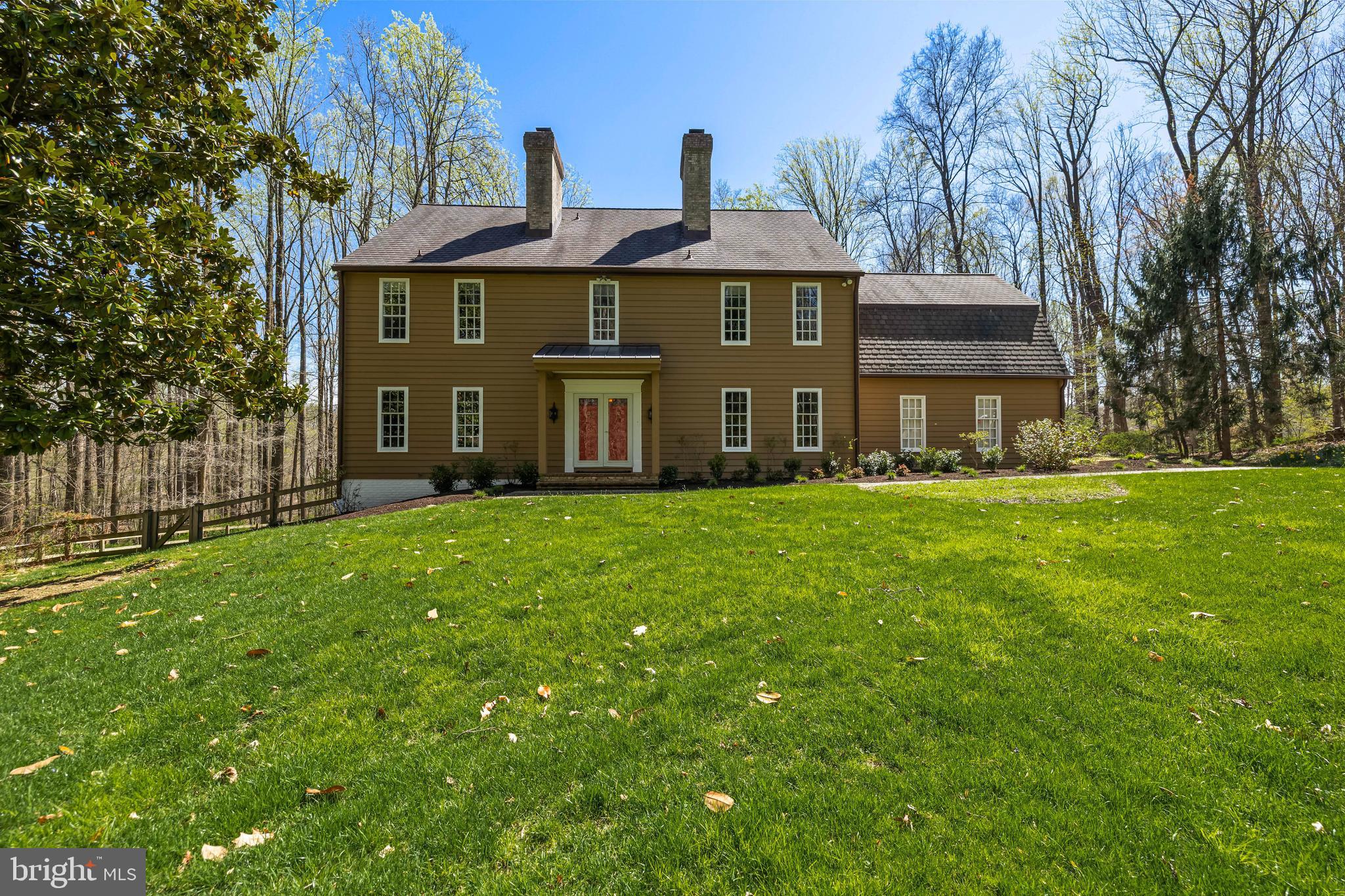 901 Chestnut Ridge Drive Lutherville-Timonium, MD 21093 - Photo 3 of 138 a front view of a house with a garden