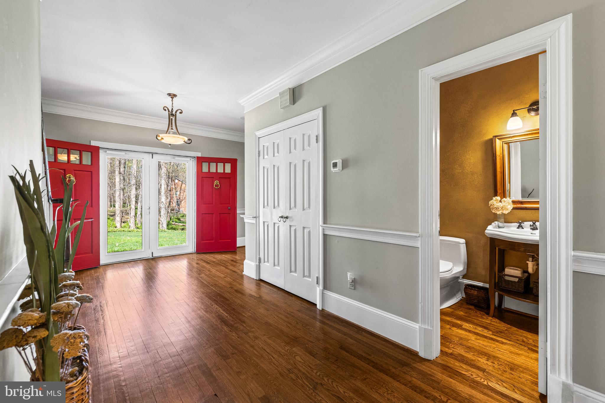 901 Chestnut Ridge Drive Lutherville-Timonium, MD 21093 - Photo 5 of 138 a view of a hallway with wooden floor and windows