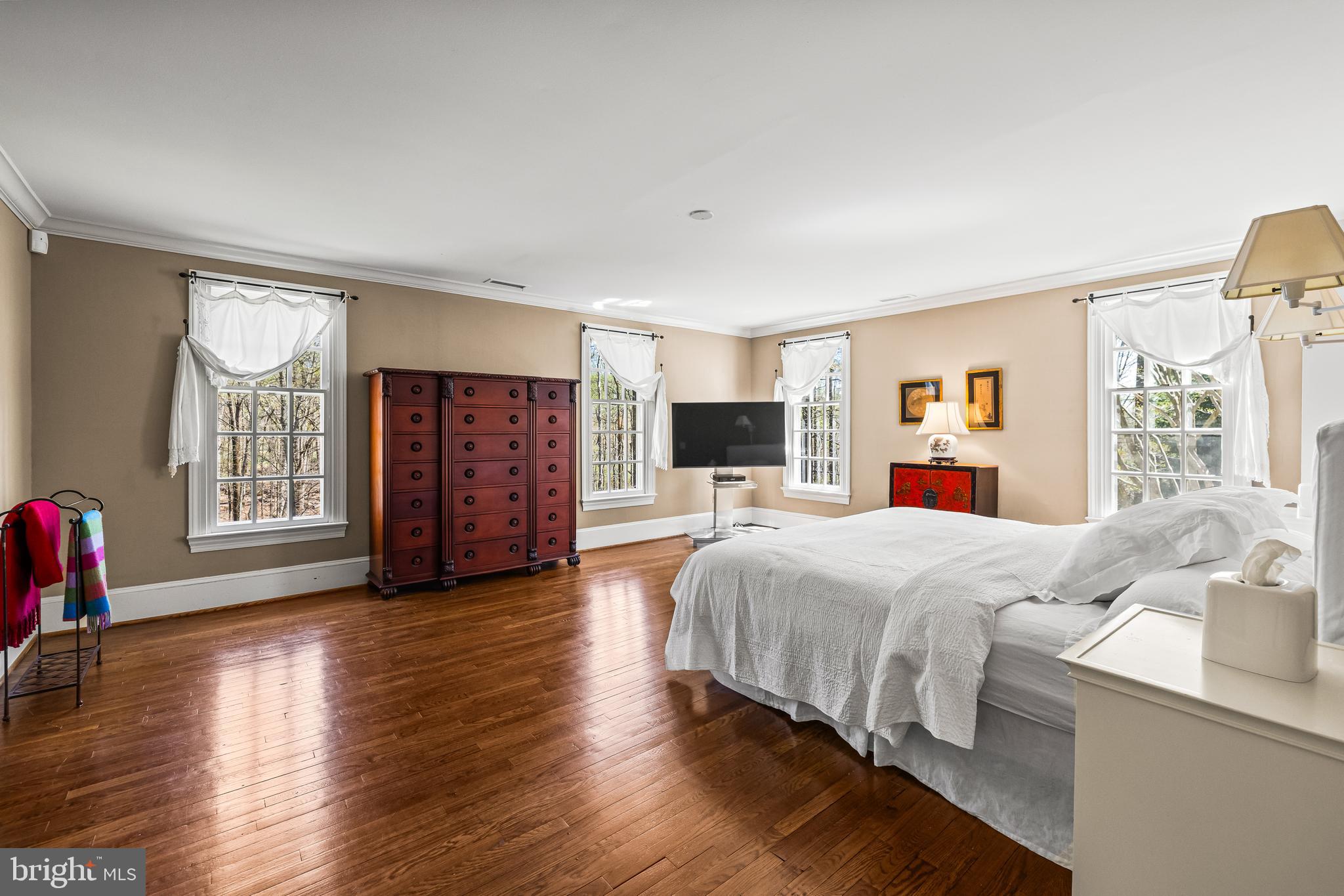 901 Chestnut Ridge Drive Lutherville-Timonium, MD 21093 - Photo 68 of 138 a spacious bedroom with a large bed and a flat tv screen