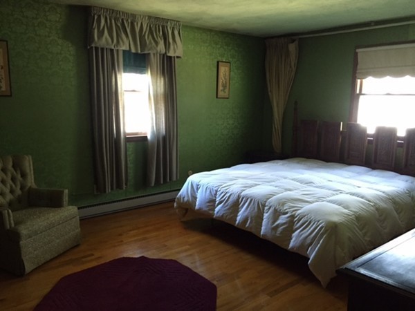 191 Potter Road Framingham, MA 01701 - Photo 8 of 13 a bed sitting in a bedroom next to a window