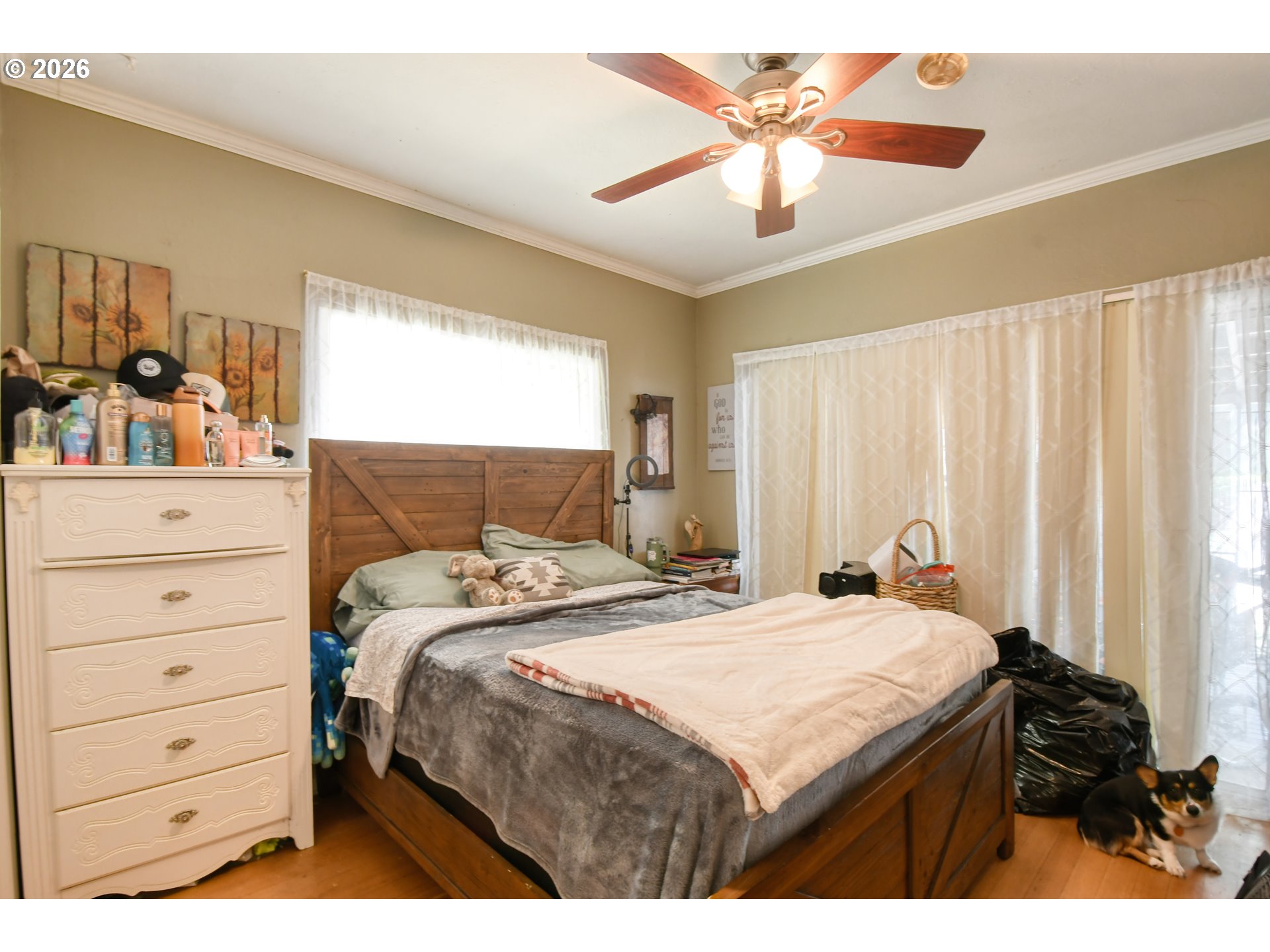 607 Southwest Court Avenue Pendleton, OR 97801 - Photo 17 of 48 a bedroom with a bed and a chandelier