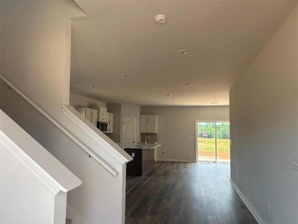 129 Cedar Shoals Easley, SC 29640 - Photo 28 of 31 An open floorplan features recessed lighting, durable flooring, and sliding doors leading to the private yard.