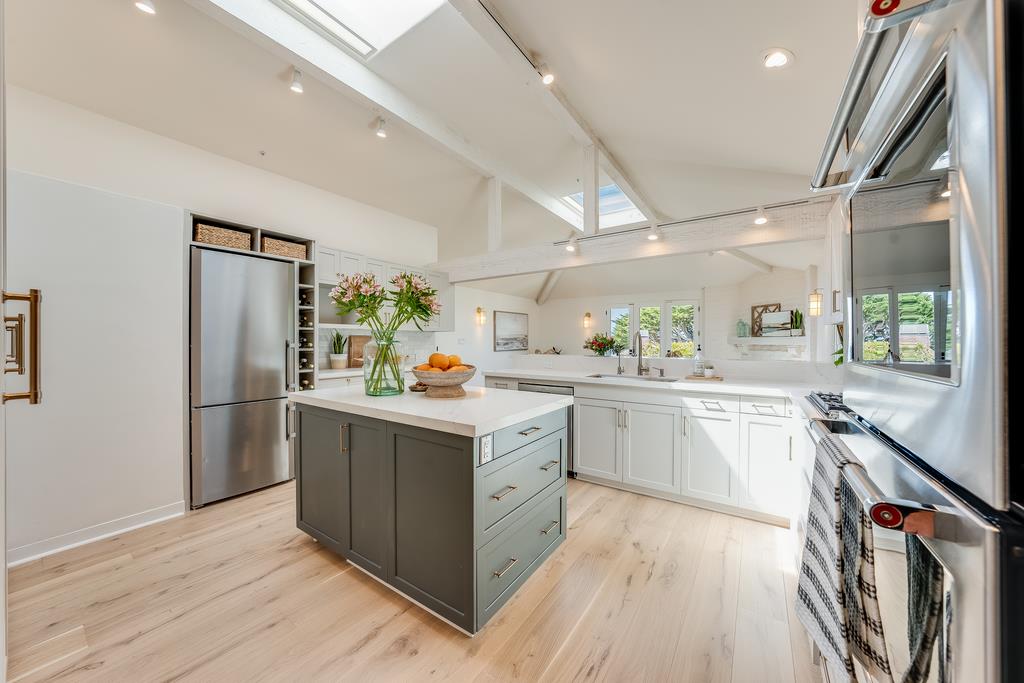 2863 Cuesta Way Carmel, CA 93923 - Photo 18 of 59 a kitchen with stainless steel appliances granite countertop a refrigerator a sink dishwasher a stove and white countertops with wooden floor
