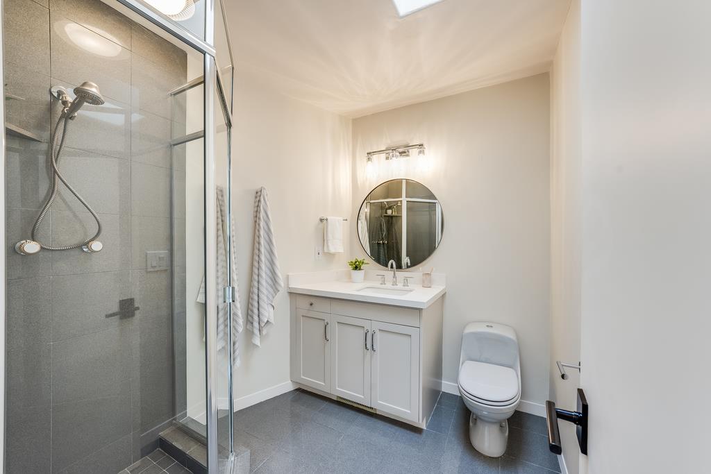 2863 Cuesta Way Carmel, CA 93923 - Photo 36 of 59 a bathroom with a toilet sink and mirror