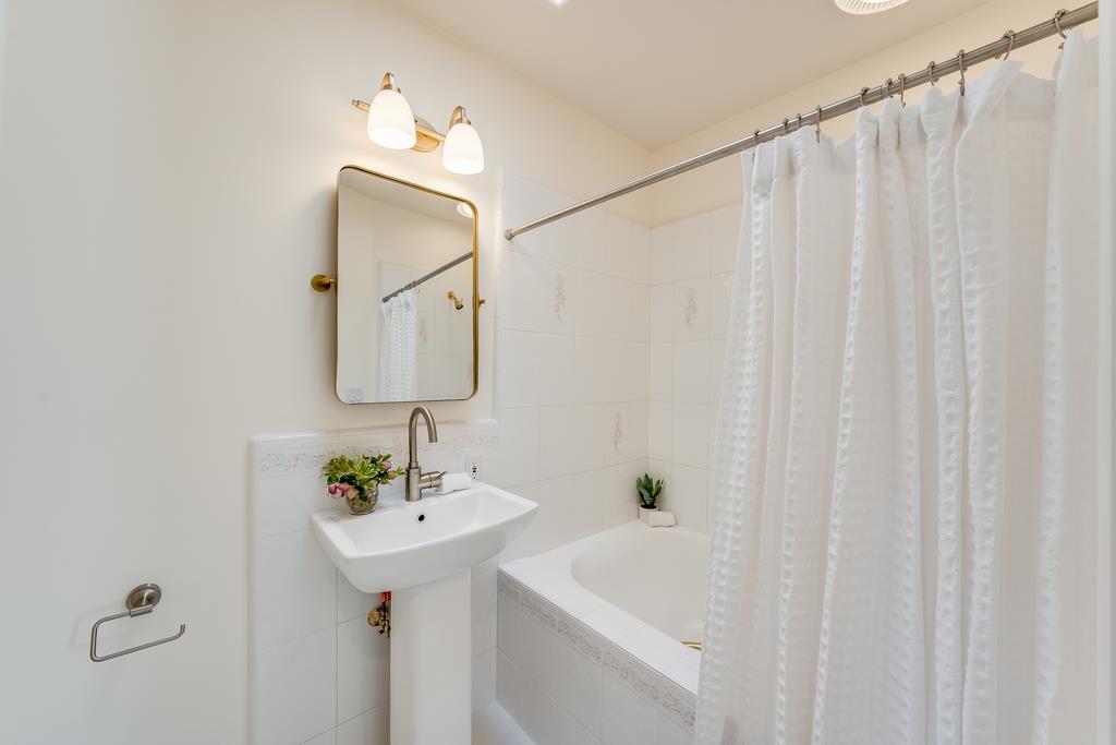 2863 Cuesta Way Carmel, CA 93923 - Photo 39 of 59 a bathroom with a sink a mirror and a shower
