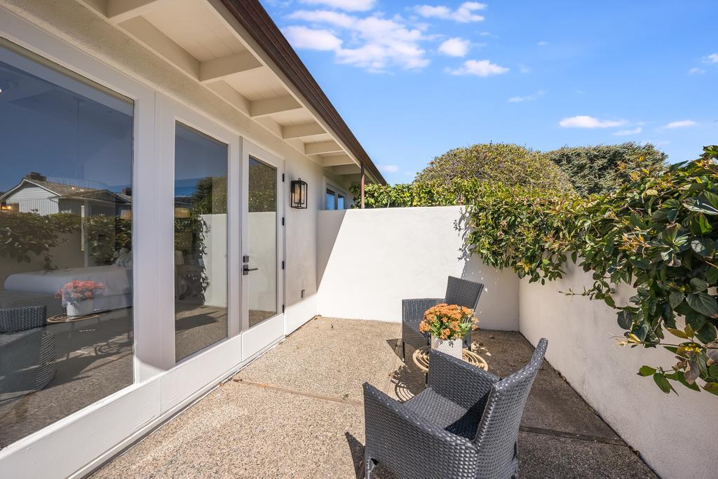 2863 Cuesta Way Carmel, CA 93923 - Photo 45 of 59 a backyard of a house with table and chairs