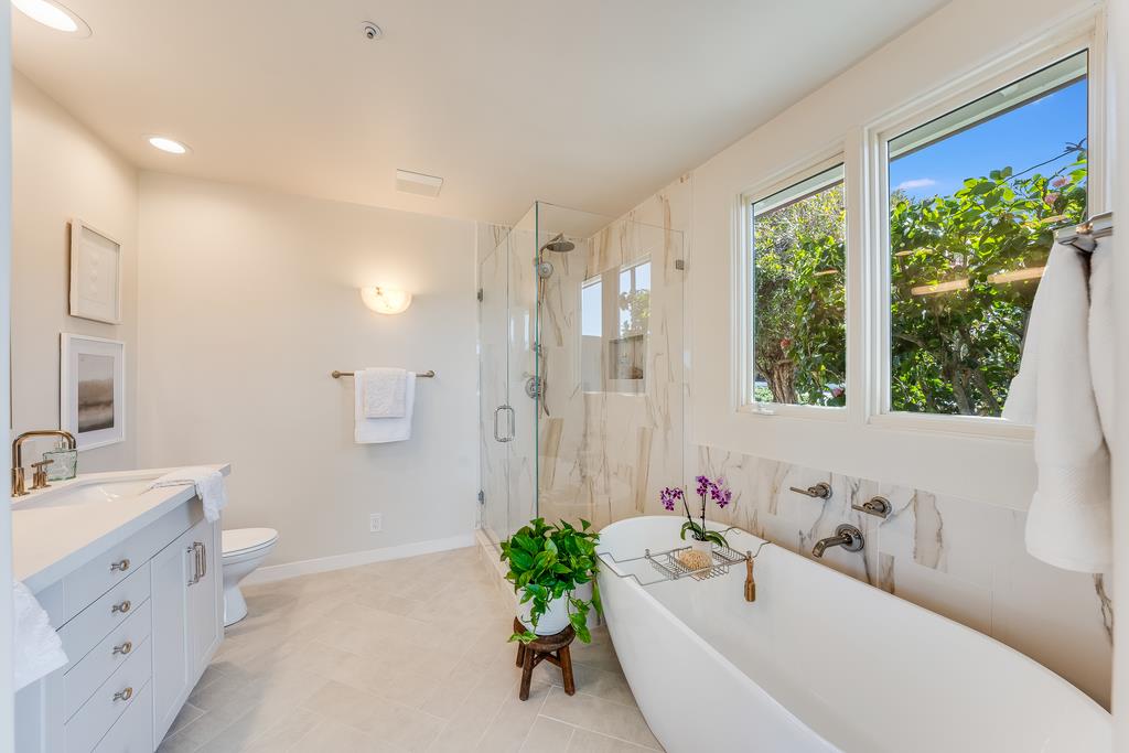 2863 Cuesta Way Carmel, CA 93923 - Photo 5 of 59 a bathroom with a tub sink and mirror