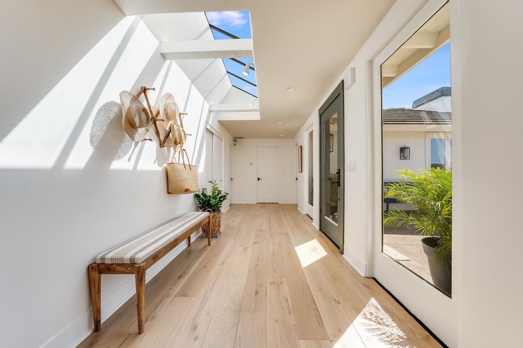 2863 Cuesta Way Carmel, CA 93923 - Photo 7 of 59 a view of a hallway with furniture and wooden floor