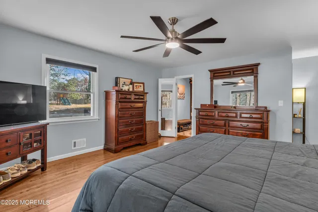 a bedroom with a bed and furniture