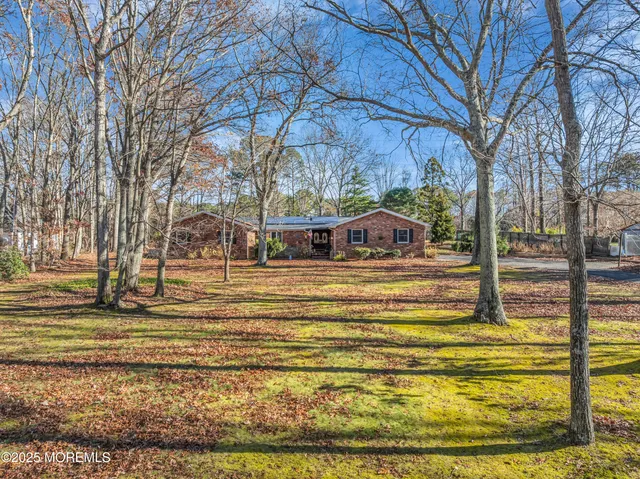 a house view with large trees