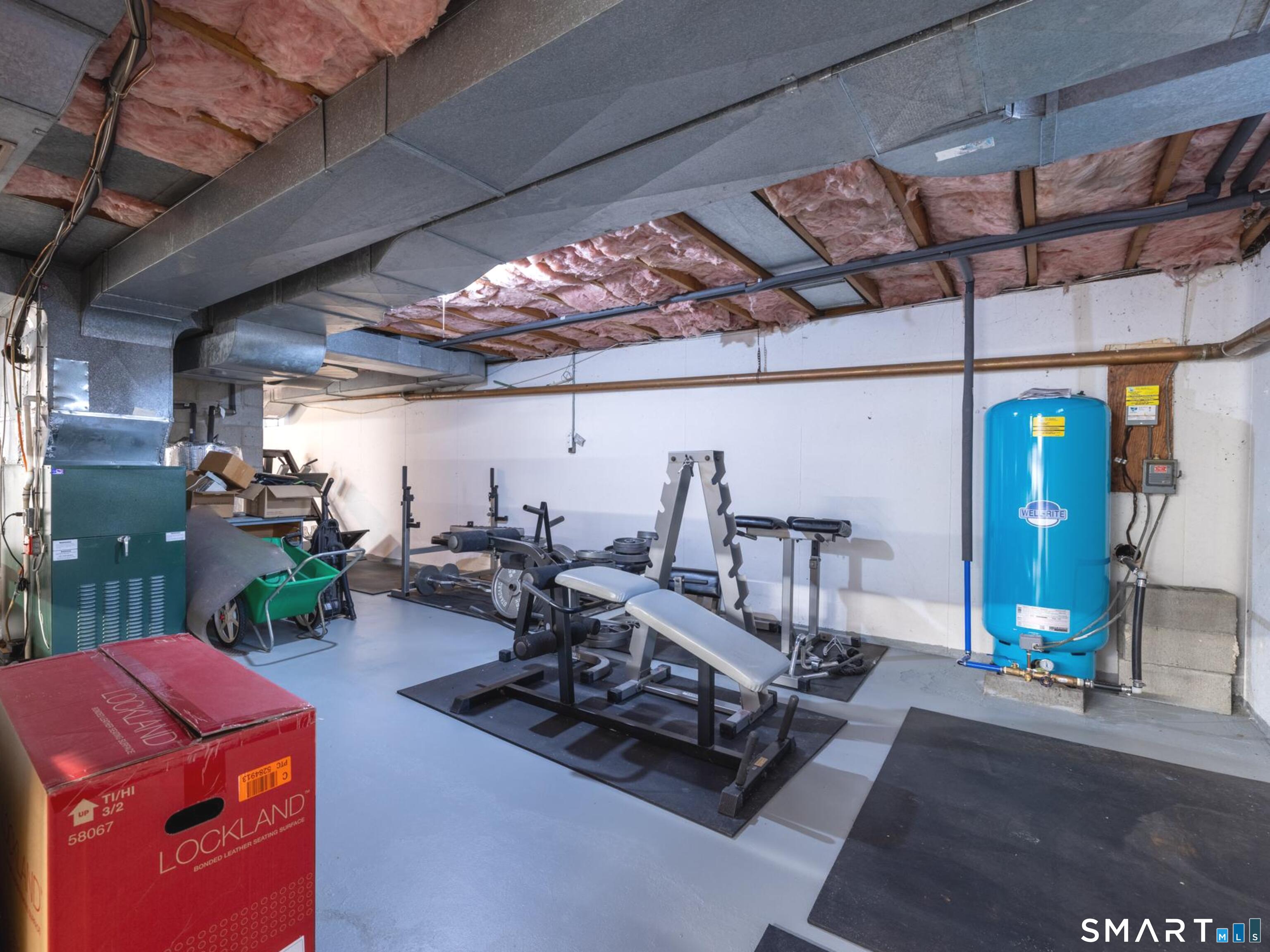 117 Crest Road Middlebury, CT 06762 - Photo 32 of 38 Large full basement area has been used for a workout area and work shop too.