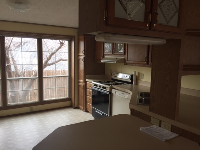 424 32 Road, Unit 148 Clifton, CO 81520 - Photo 12 of 26 a kitchen with a stove and a refrigerator