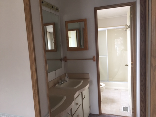 424 32 Road, Unit 148 Clifton, CO 81520 - Photo 17 of 26 a bathroom with a sink and vanity