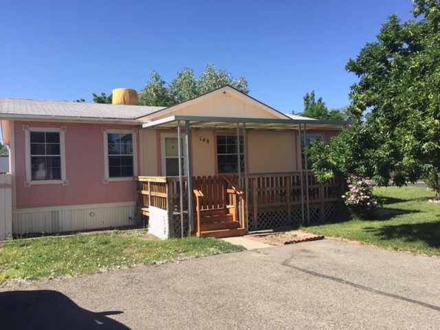 424 32 Road, Unit 148 Clifton, CO 81520 - Photo 26 of 26 a front view of a house with a garden