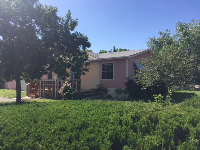 424 32 Road, Unit 148 Clifton, CO 81520 - Photo 4 of 26 a view of a house with a yard and sitting area
