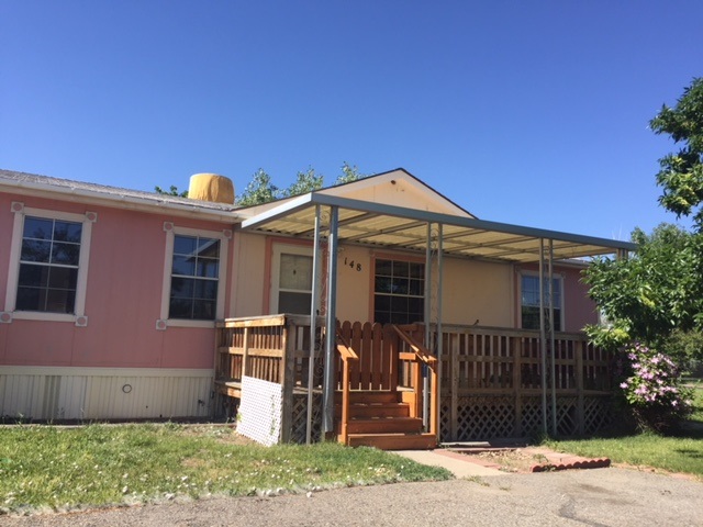424 32 Road, Unit 148 Clifton, CO 81520 - Photo 5 of 26 a front view of a house with garden