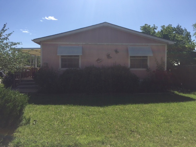 424 32 Road, Unit 148 Clifton, CO 81520 - Photo 6 of 26 a front view of a house with a yard