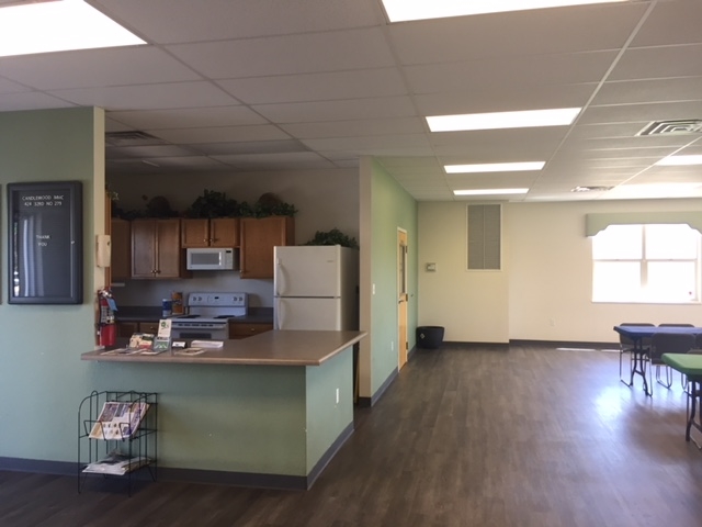 424 32 Road, Unit 148 Clifton, CO 81520 - Photo 8 of 26 a kitchen with stainless steel appliances granite countertop a refrigerator a sink a stove and a wooden floors