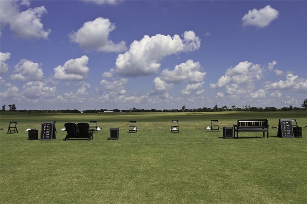 Undisclosed Address Lakewood Ranch, FL 34211 - Photo 24 of 28 a view of a lake with houses in back