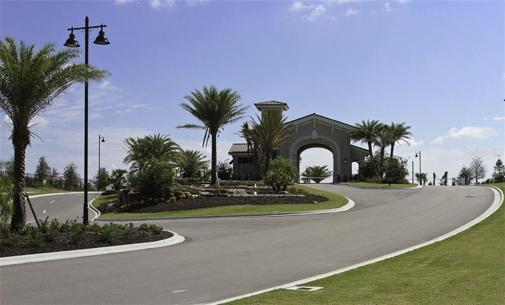 Undisclosed Address Lakewood Ranch, FL 34211 - Photo 28 of 28 a front view of a house with garden and trees