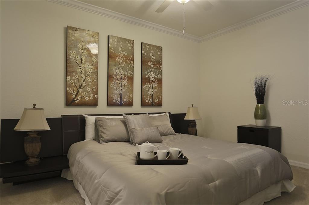 Undisclosed Address Lakewood Ranch, FL 34211 - Photo 9 of 28 a bedroom with a bed and window