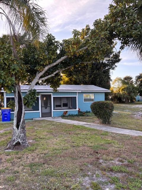 5392 Southeast 48th Avenue, Unit A Stuart, FL 34997 - Photo 3 of 12 a view of a house with a yard