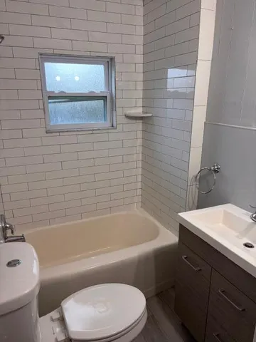 a bathroom with a sink toilet and bathtub