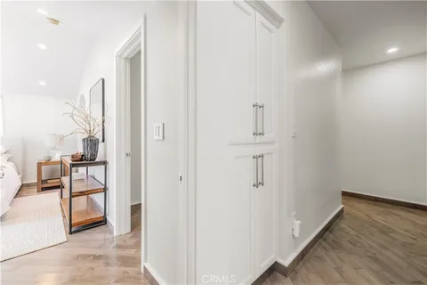 a spacious bedroom with a bed a couch and a window