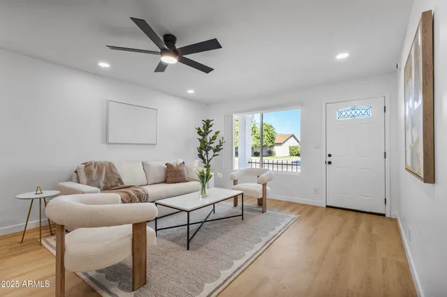 a living room with furniture and a window