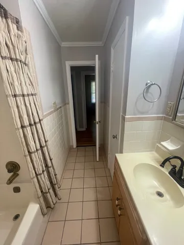 a bathroom with a bathtub and toilet