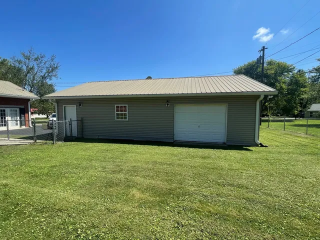 a view of a hallway with seating space