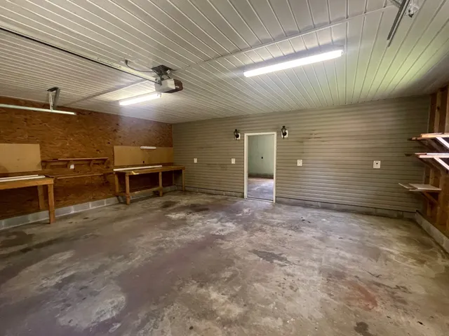 a view of an empty room with windows