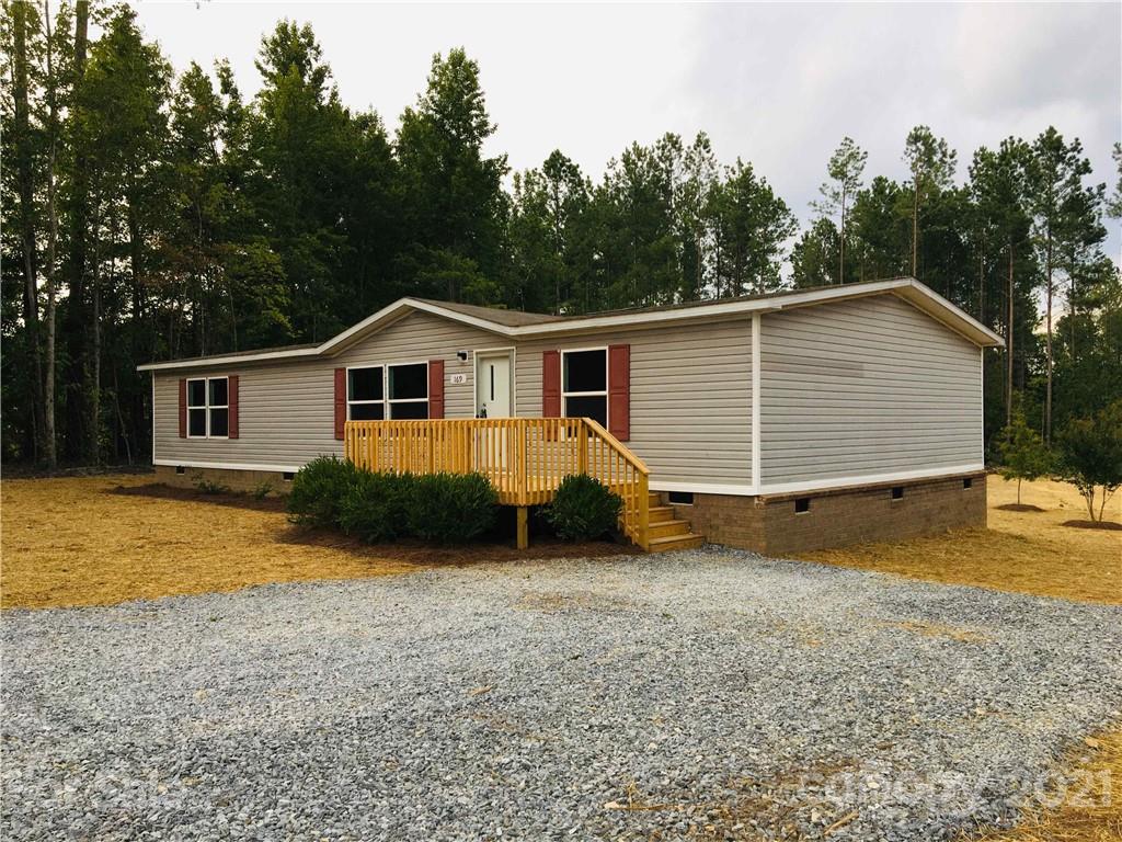 169 Mosley Road Blacksburg, SC 29702 - Photo 2 of 20 a view of a house with a yard and roof