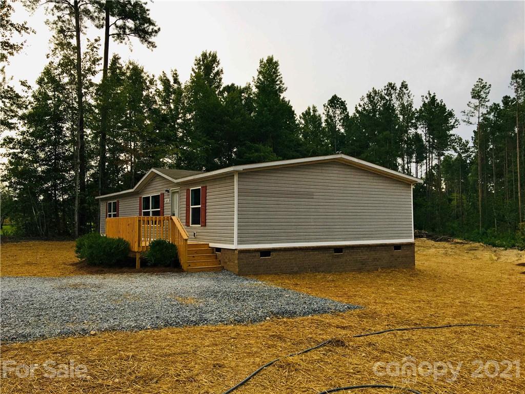 169 Mosley Road Blacksburg, SC 29702 - Photo 4 of 20 a view of a house with a backyard